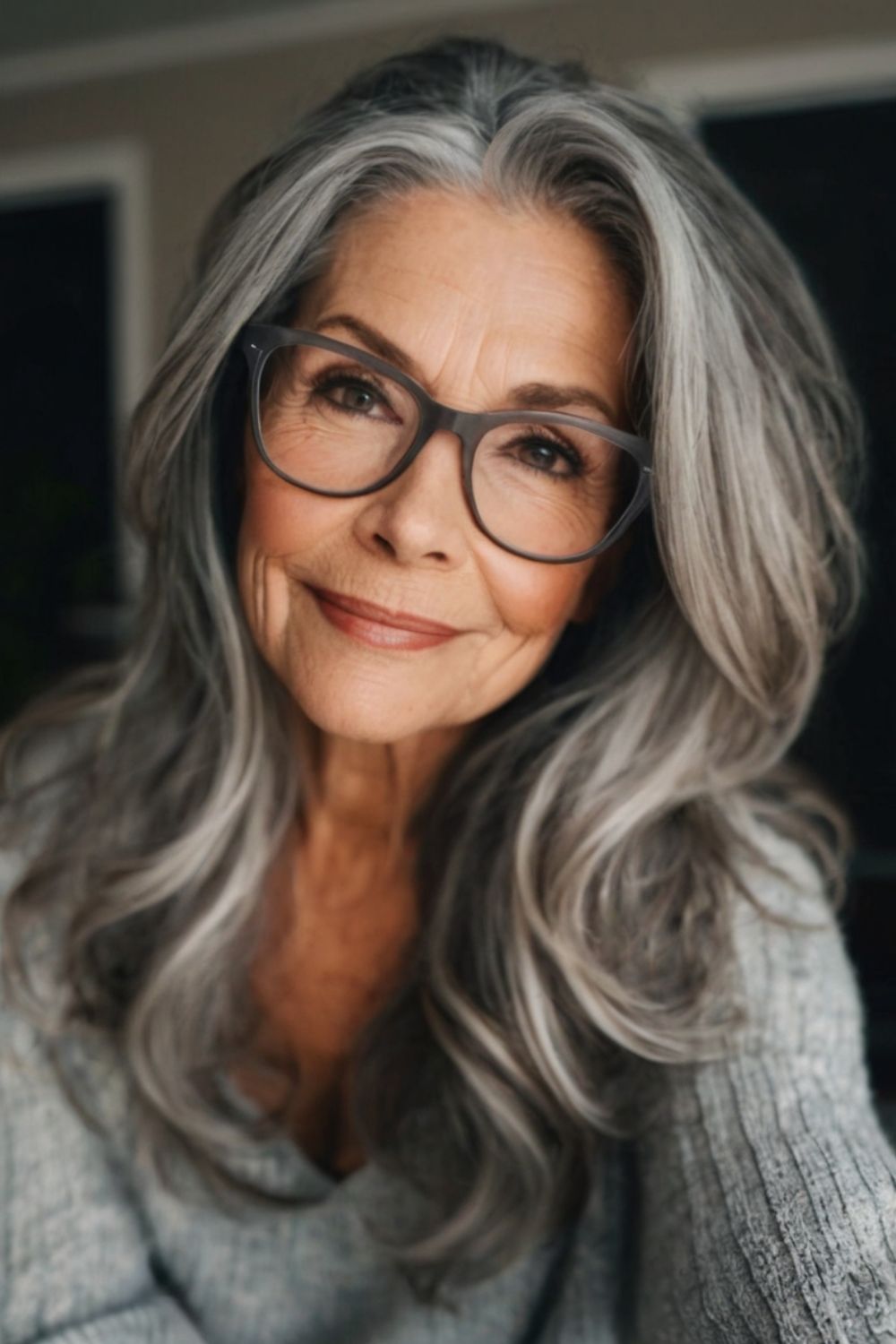 Mid-Length Gray Curls Hairstyle for Women Over 60 with Glasses